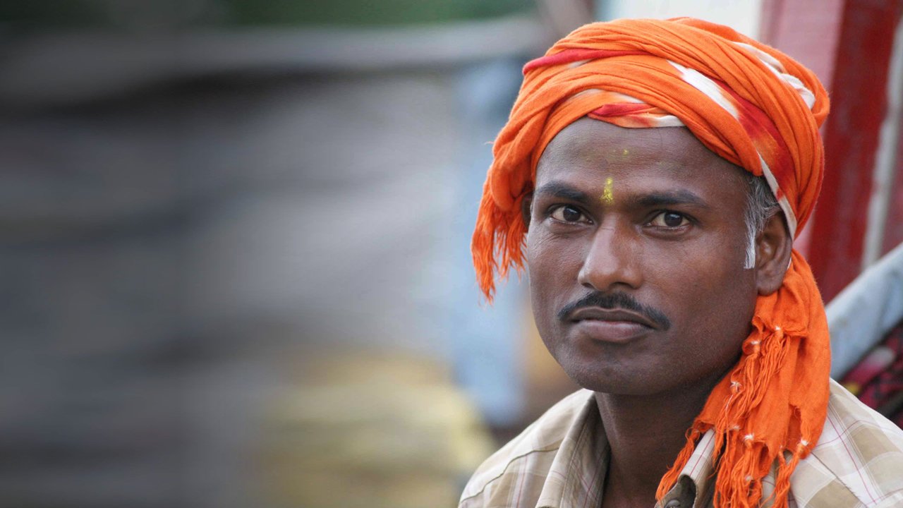 Indian man stares back at the camera